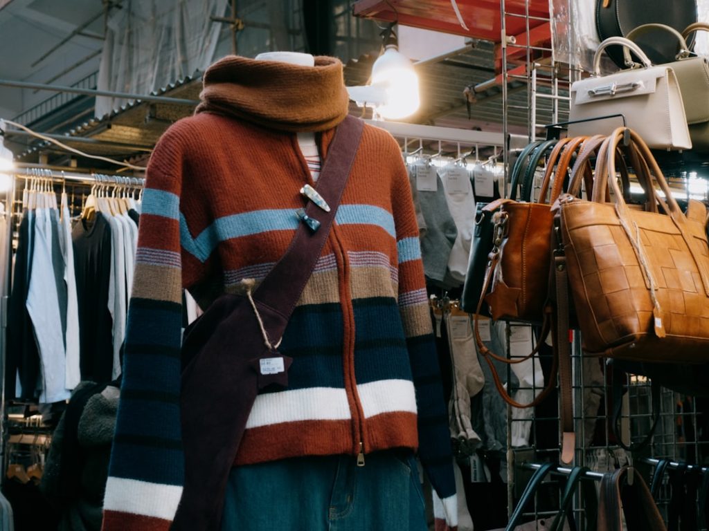 a-mannequin-wearing-a-multicolored-sweater-in-a-clothing-store-f9a07d9ymkm