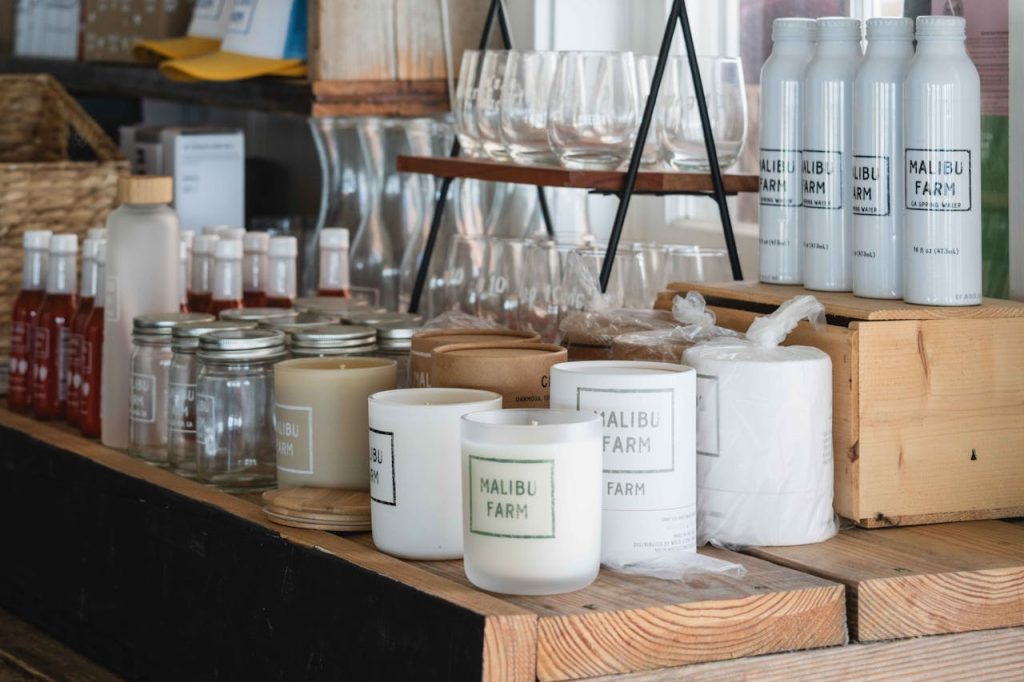 Explore the cozy rustic charm of Malibu Farm store showcasing organic products and chic decor.
