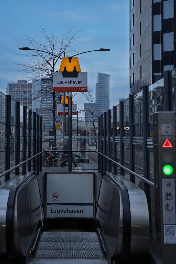 A chilly evening view of Leuvehaven station entrance in Rotterdam.